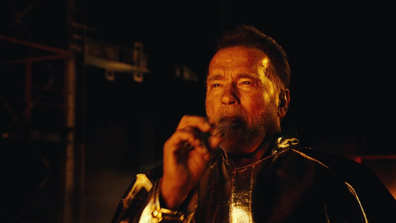 Arnold Schwarzenegger in a silver heat suit with a cigar at the steel foundry, from Figure's F.02 film